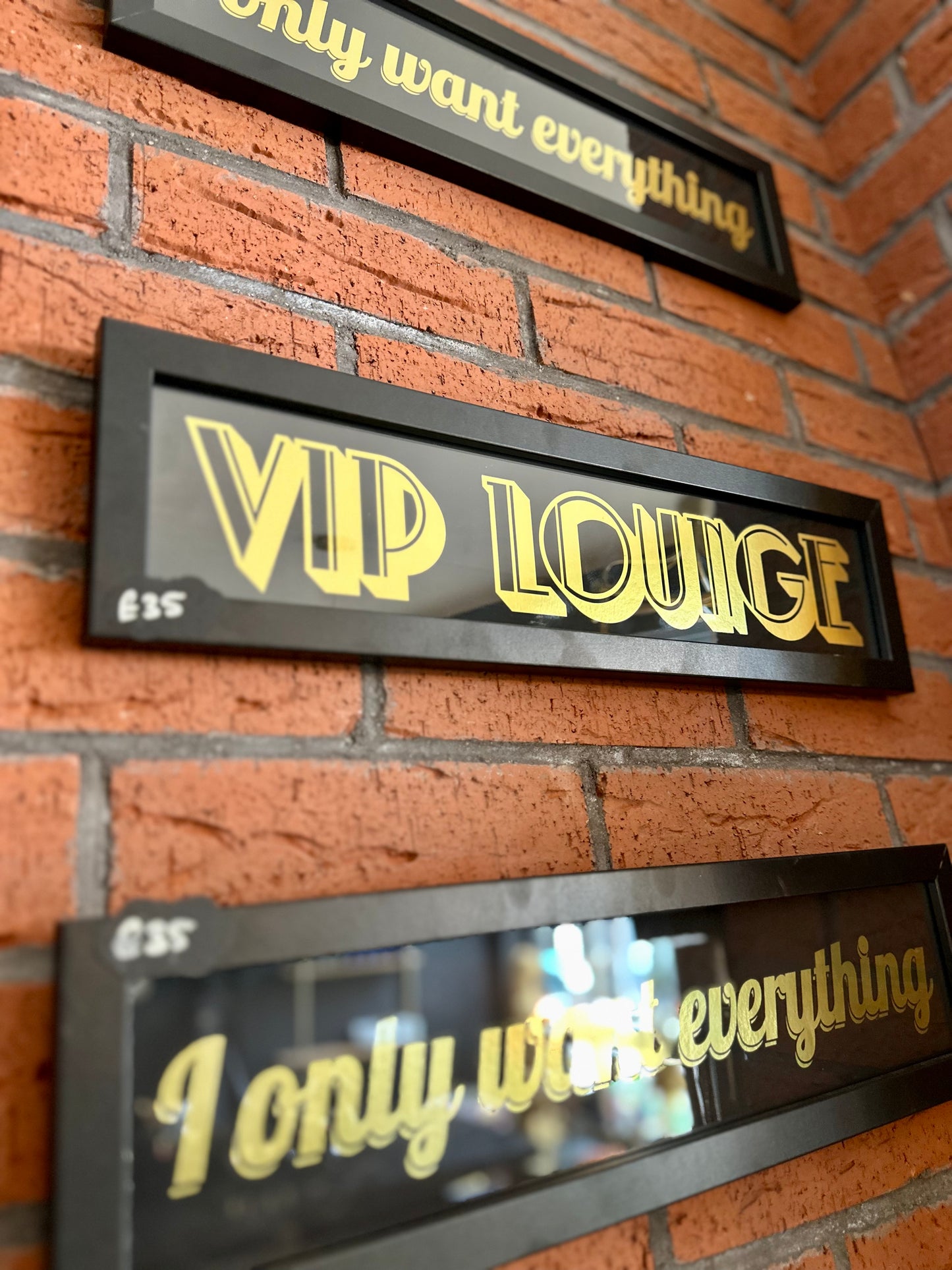 black and gold wall signs